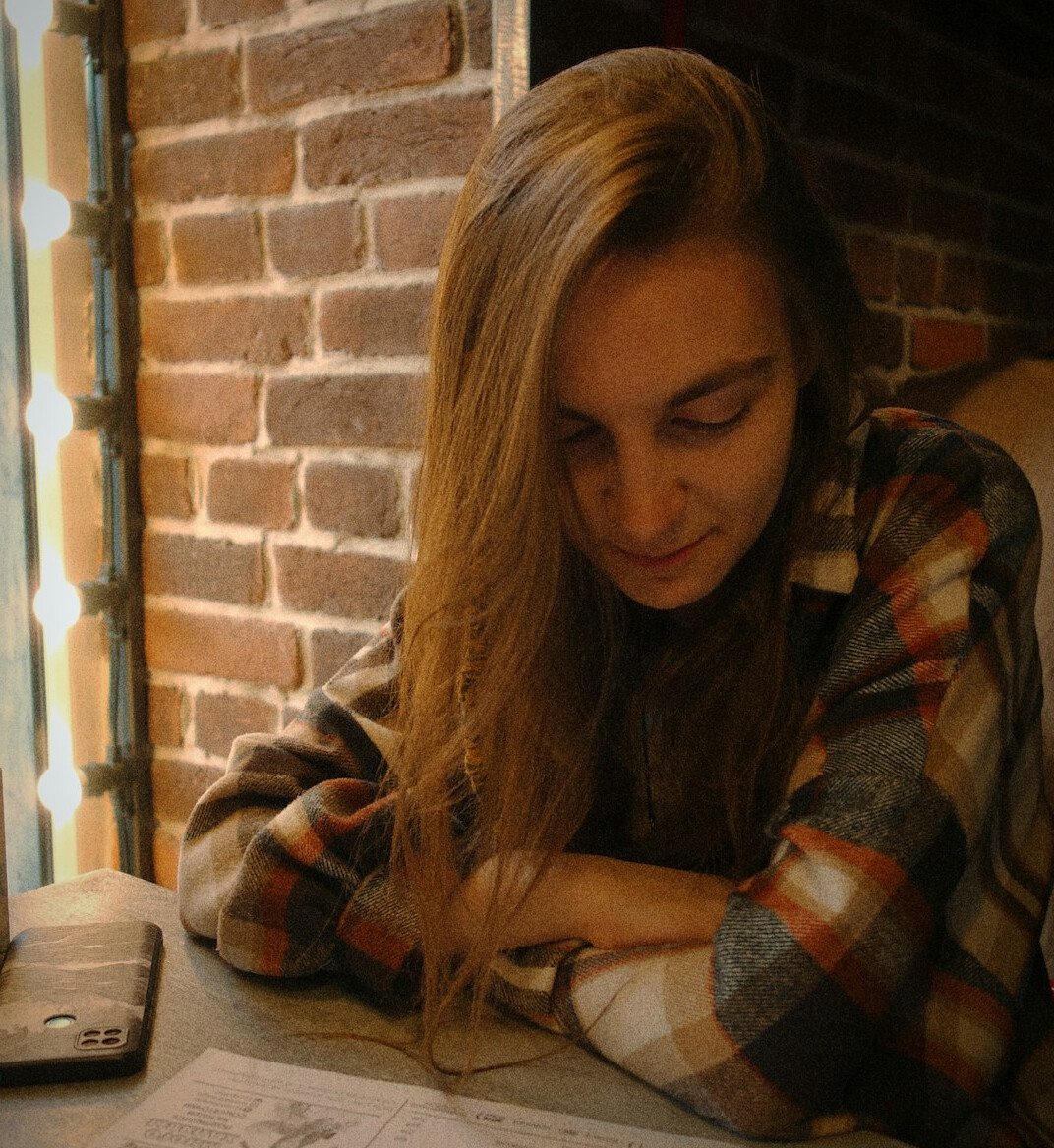woman checking bills at table