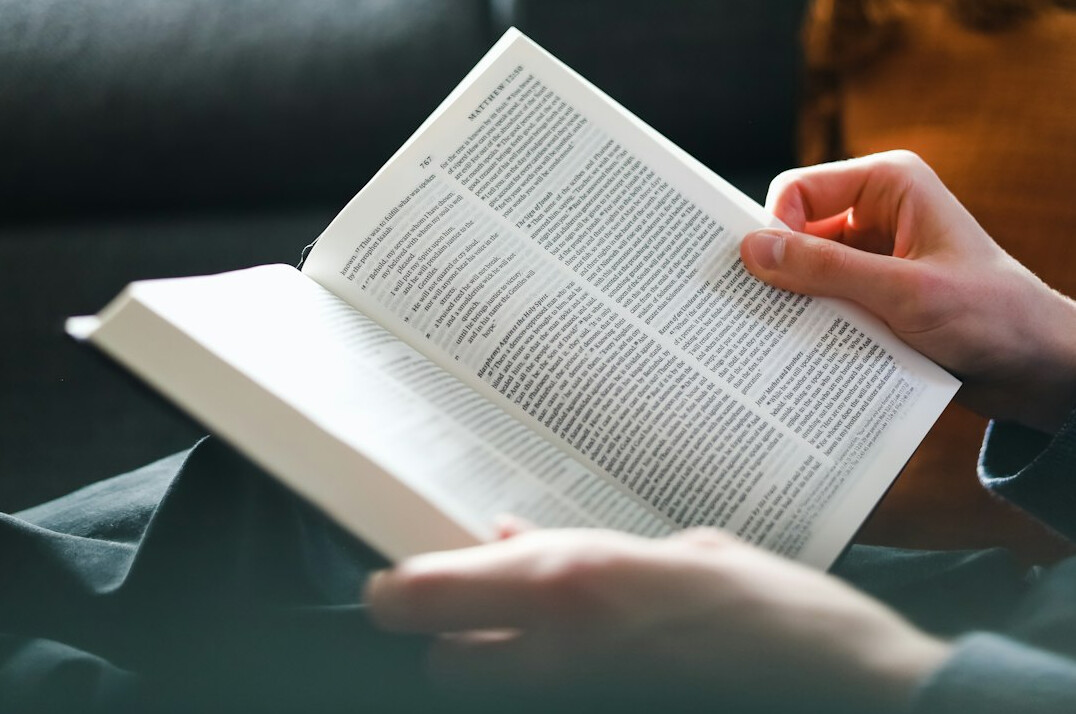 person reading financial book